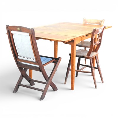 Lot 515 - A 1920s oak draw-leaf table, 152cm wide...
