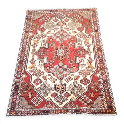 Lot 556 - A Persian Rudbar rug, with a large central...
