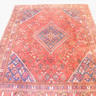 Lot 317 - A Persian carpet, having a central lozenge on...
