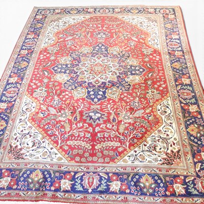 Lot 469 - A Persian Tabriz carpet, with a central...