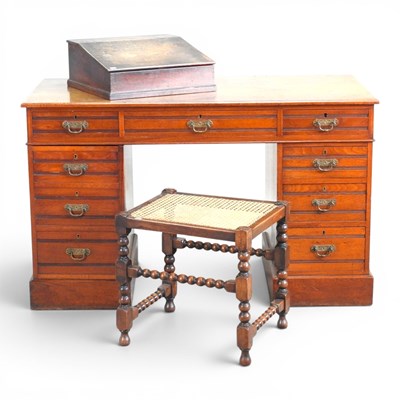 Lot 371 - An Edwardian walnut pedestal desk, together...