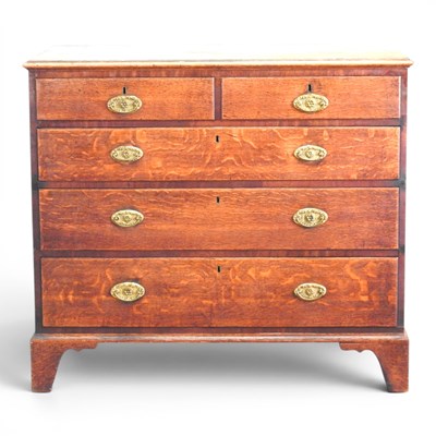 Lot 141 - A George III oak chest, on bracket feet