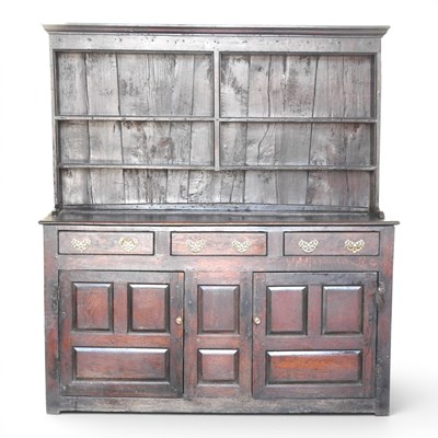 Lot 236 - An 18th century oak dresser, with a boarded...