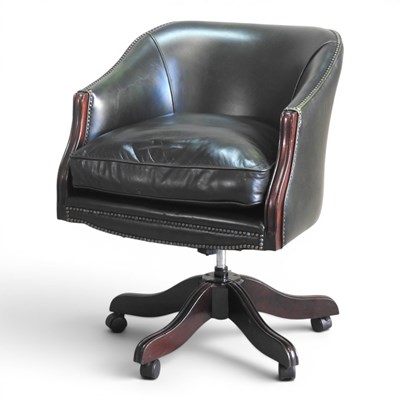 Lot 119 - A green leather upholstered swivel desk chair,...