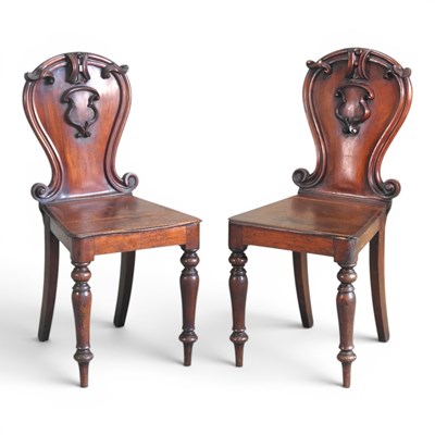 Lot 201 - A pair of Victorian mahogany hall chairs, each...