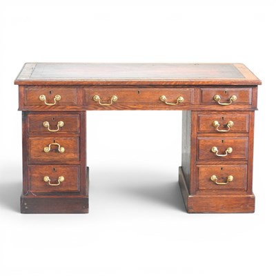 Lot 289 - An Edwardian oak pedestal desk, with an inset...
