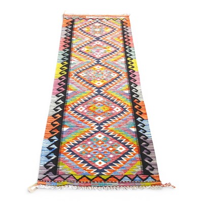 Lot 115 - A Persian kilim runner, with five central...