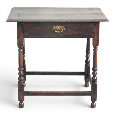 Lot 234 - An 18th century oak side table, containing a...