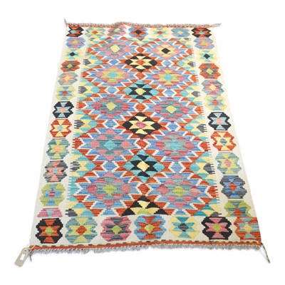 Lot 268 - A Persian kilim rug, with all over medallions,...