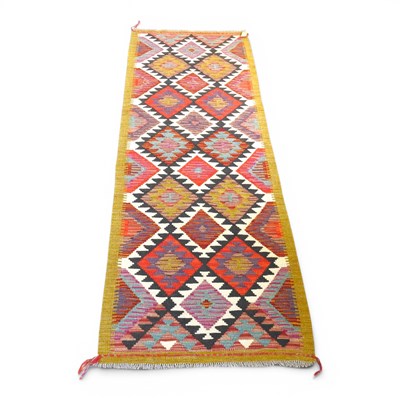 Lot 719 - A kilim runner, with all over coloured...