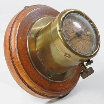 Lot 46 - An early 20th century brass dashboard clock