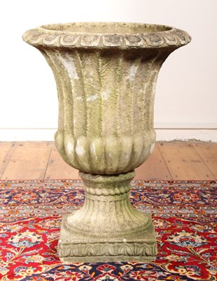 Lot 577 - A reconstituted stone planter, in the form of...