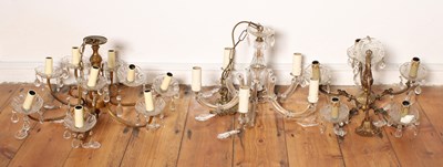 Lot 495 - Three cut glass and brass chandeliers