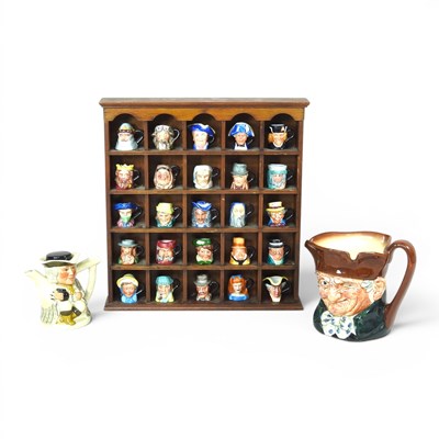 Lot 113 - A collection of miniature character jugs, in...