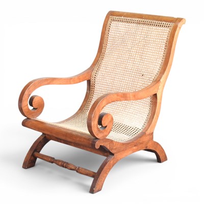 Lot 29 - A large teak plantation chair, with a cane...