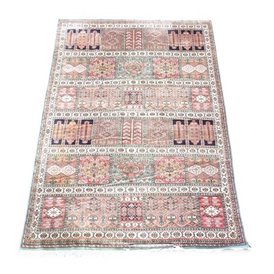 Lot 191 - A Persian carpet, with floral panels, within...