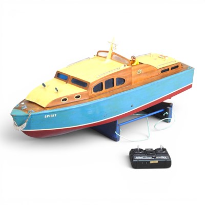 Lot 166 - A remote control painted wooden model boat,...