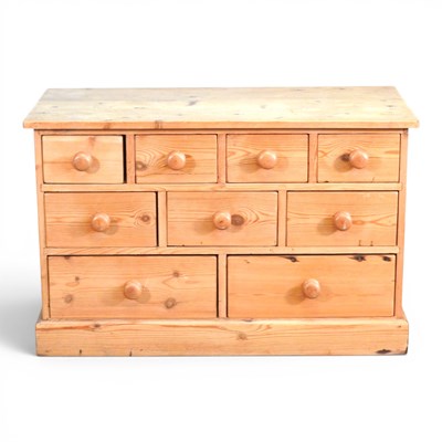 Lot 134 - A pine chest, containing an arrangement of...