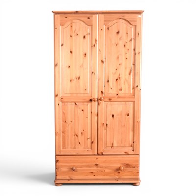Lot 390 - A pine modern wardrobe, with a drawer below