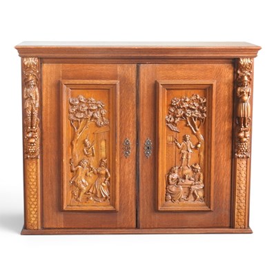 Lot 508 - A mid 20th century continental carved oak side...