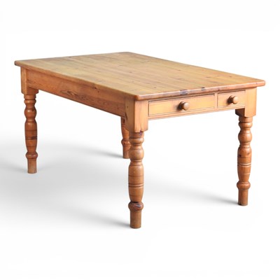 Lot 645 - An antique pine dining table, on turned legs