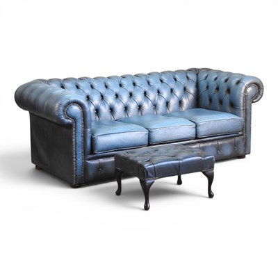 Lot 123 - A blue upholstered chesterfield sofa, with a...