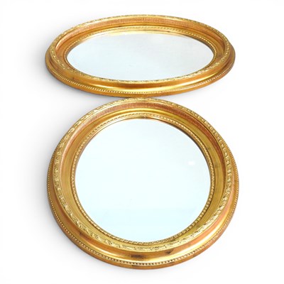Lot 377 - A pair of modern gilt framed oval wall mirrors,...
