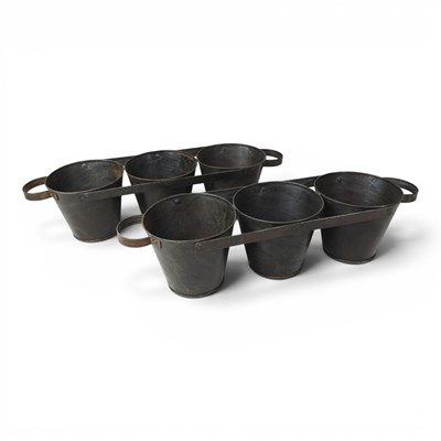 Lot 637 - Two metal garden pots, each mounted in a frame,...