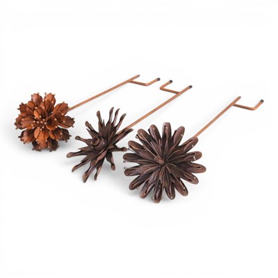 Lot 759 - Three small rusted metal garden flower shaped...
