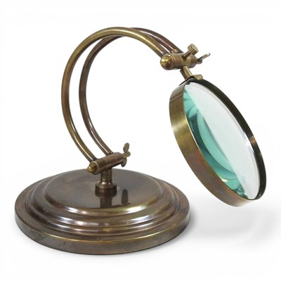Lot 375 - A metal table magnifying glass, 23cm high