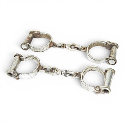 Lot 111 - A pair of handcuffs, 30cm, together with...