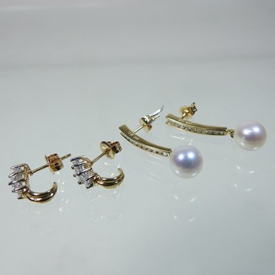 Lot 65 - A pair of 10 carat gold diamond earrings
