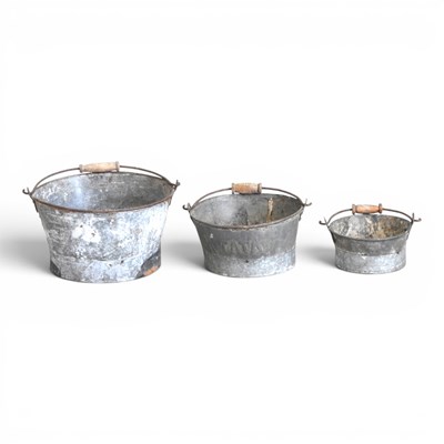 Lot 536 - Three graduated metal garden pots, with wooden...