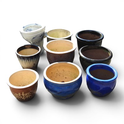 Lot 514 - A collection of glazed garden pots, largest...