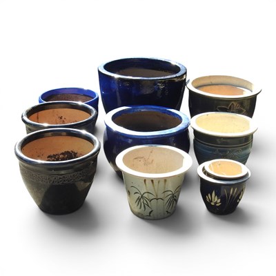 Lot 484 - A collection of glazed garden pots, largest...