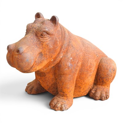 Lot 62 - A rusted cast metal garden statue of a hippo,...