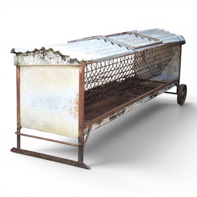 Lot 301 - A galvanised hay rack/feeder, on an iron base,...