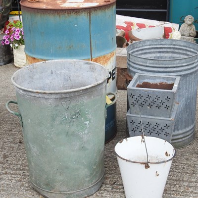 Lot 651 - An old Petronas oil drum, 89cm high, together...