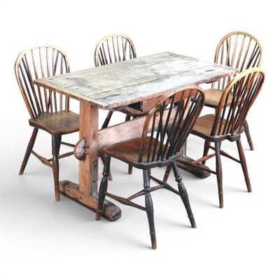 Lot 700 - A 19th century elm stretcher table, on a...