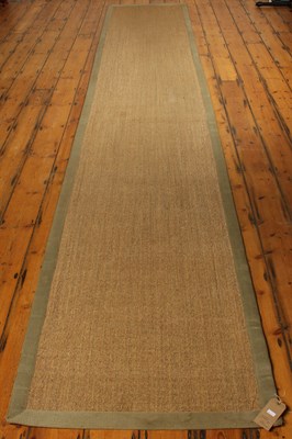 Lot 560 - A woven jute runner rug, 500 x 86cm, together...