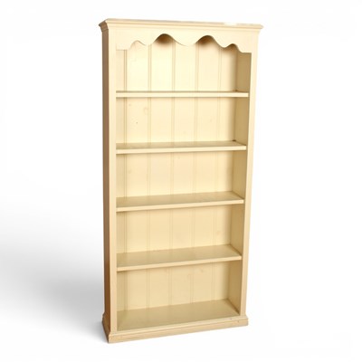 Lot 568 - A white painted pine open bookcase