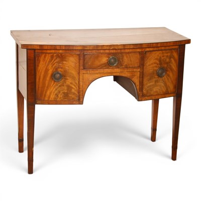 Lot 693 - A George III mahogany bow-front sideboard