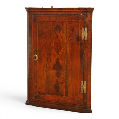 Lot 534 - A George III walnut corner cupboard