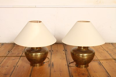 Lot 696 - A pair of brass table lamps, each with a white...