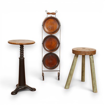 Lot 570 - A cast iron piano stool, together with a...