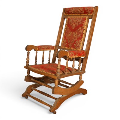 Lot 624 - A late 19th century American rocking chair