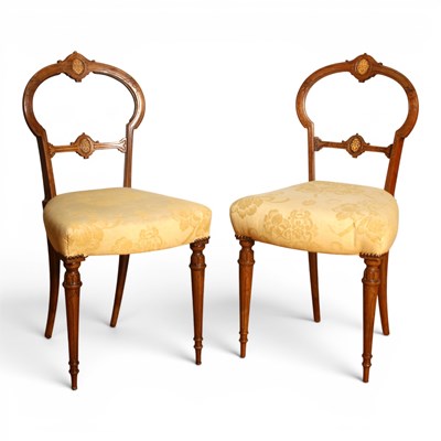 Lot 611 - A pair of Victorian walnut balloon back chairs