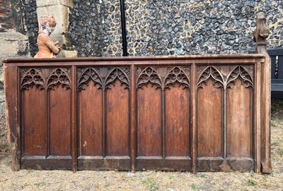 Lot 478 - A Gothic carved oak pew end, relief decorated...