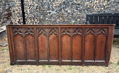 Lot 479 - A Gothic carved oak pew end, relief decorated...