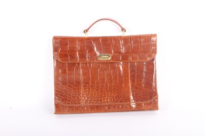 Lot 721 - A lady's crocodile leather suitcase